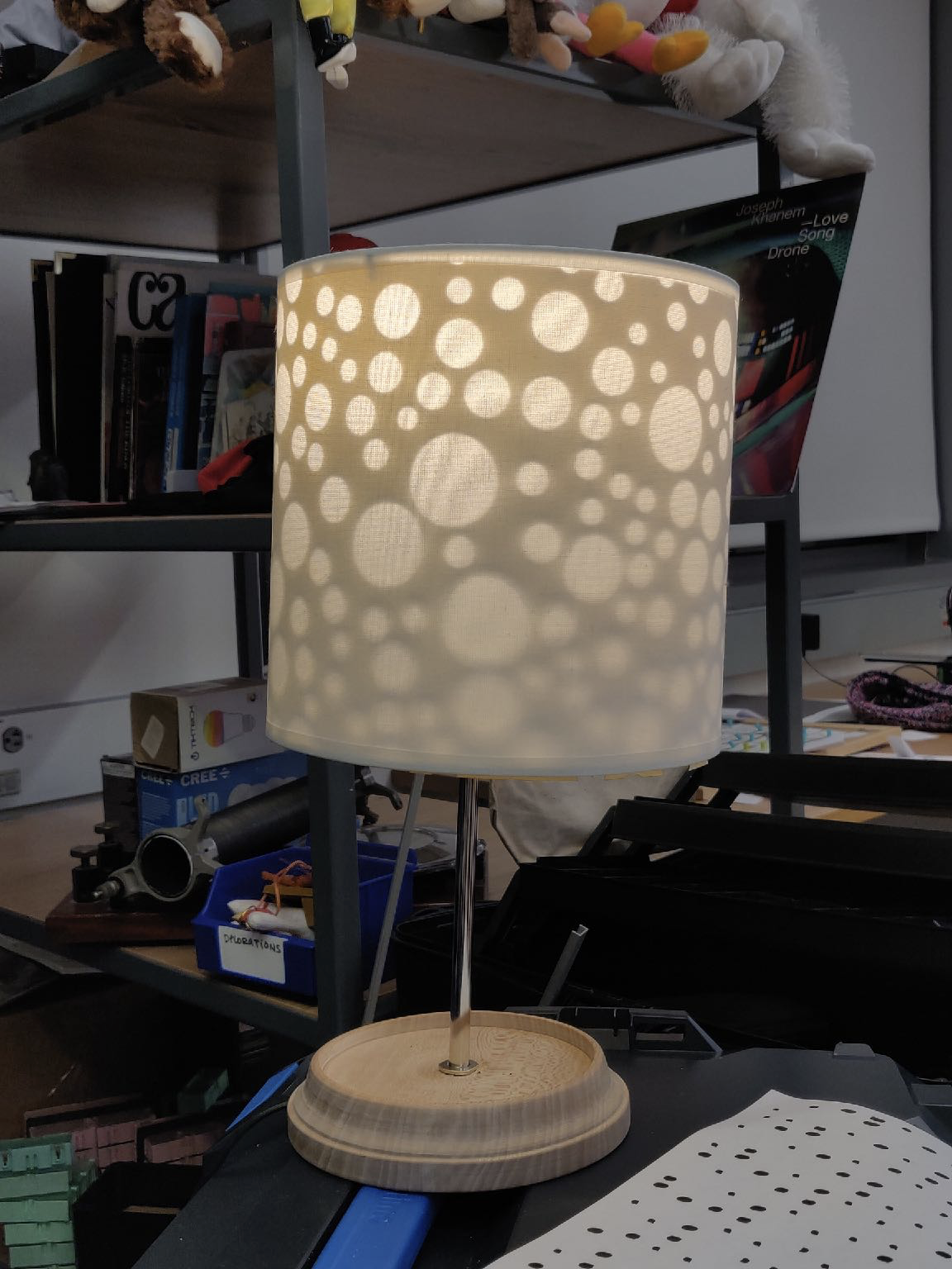 Photo of a table lamp with a polka dot patterned shade